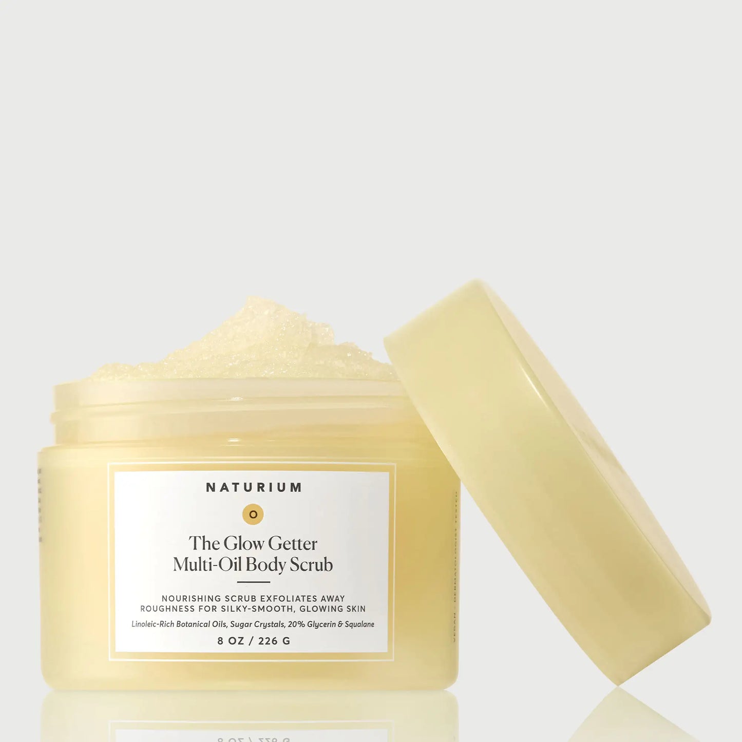 the-glow-getter-multi-oil-body-scrub-n6 NATR-40028-GlowGetter-Multi-Oil-Body-Scrub-Front-CapOff-bonebkgd.webp